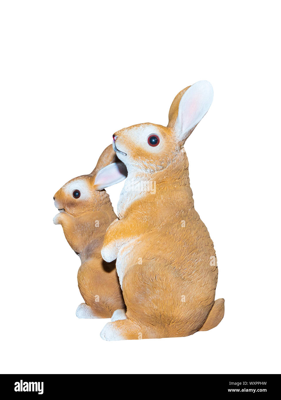 Two rabbits dolly toy is standing isolated on a white background Stock Photo