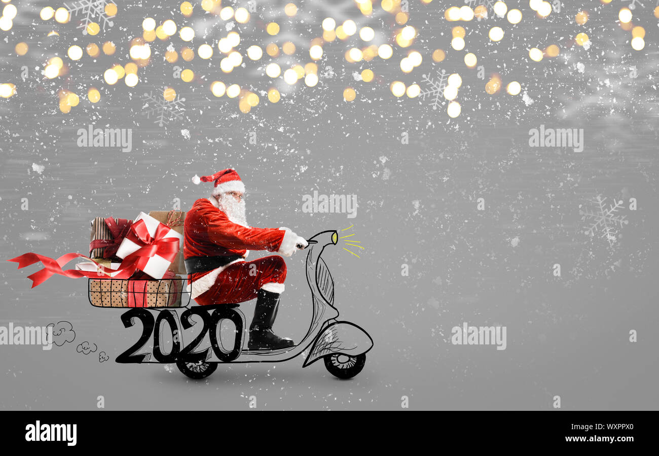 Santa Claus on scooter Stock Photo