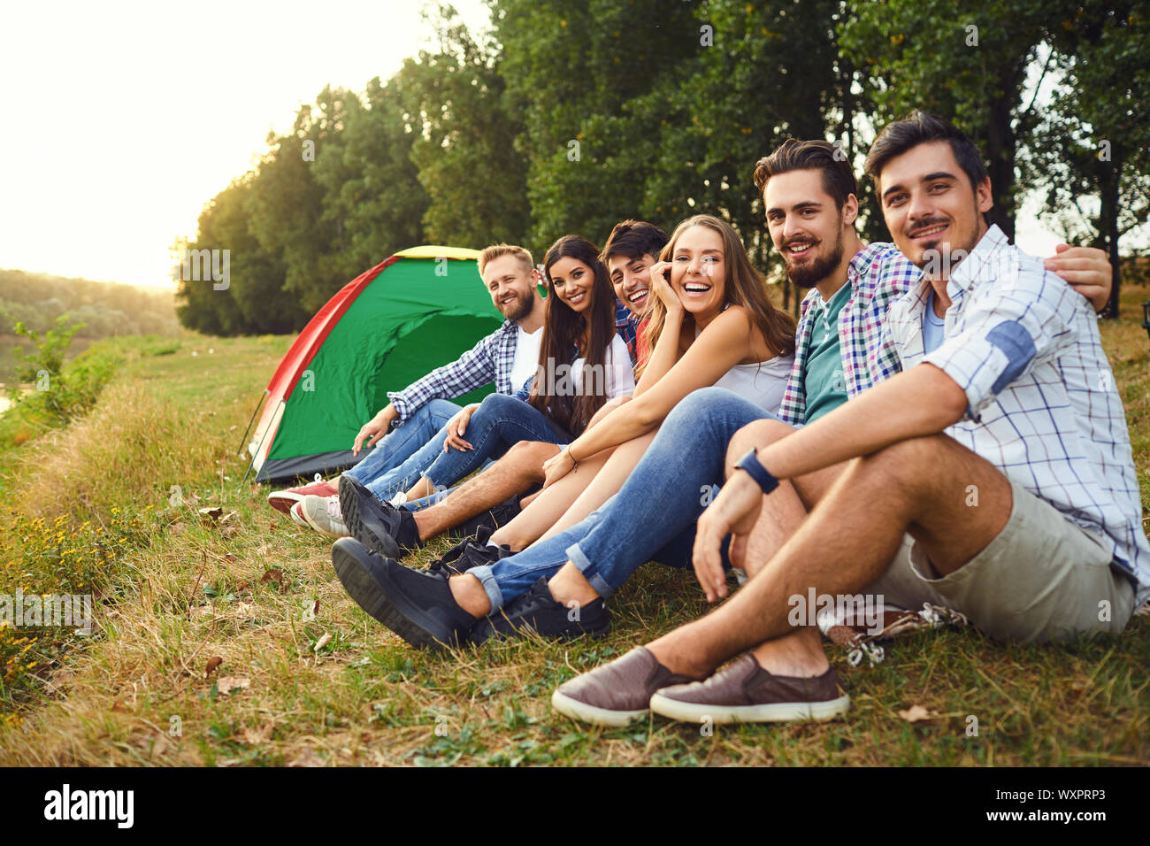 A group of friends on a picnic on the nature. Stock Photo