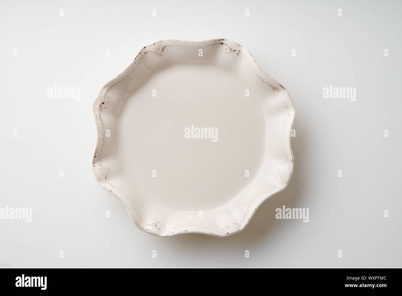 White empty plate on white background Stock Photo - Alamy