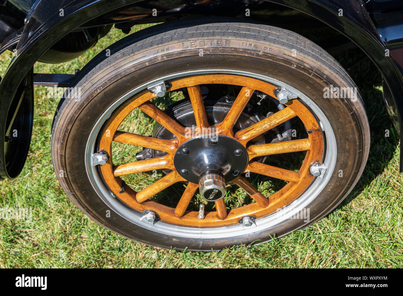 HICKORY, NC, USA-7 SEPT 2019: Wood spoked wheel of 1915 Buick C-25. Tire is from Lester Tire Co. Stock Photo