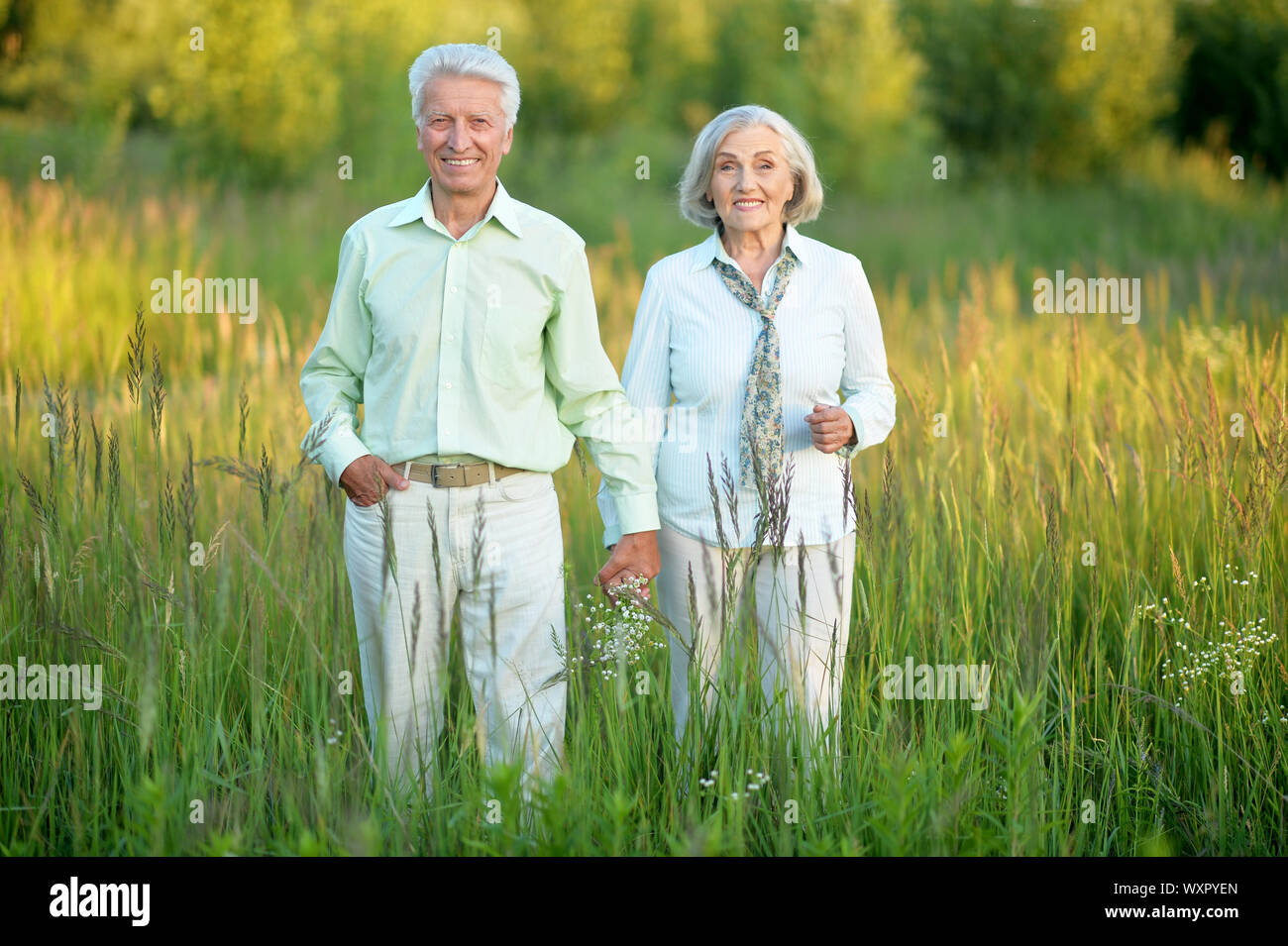 beautiful caucasian senior couple in the park Stock Photo - Alamy
