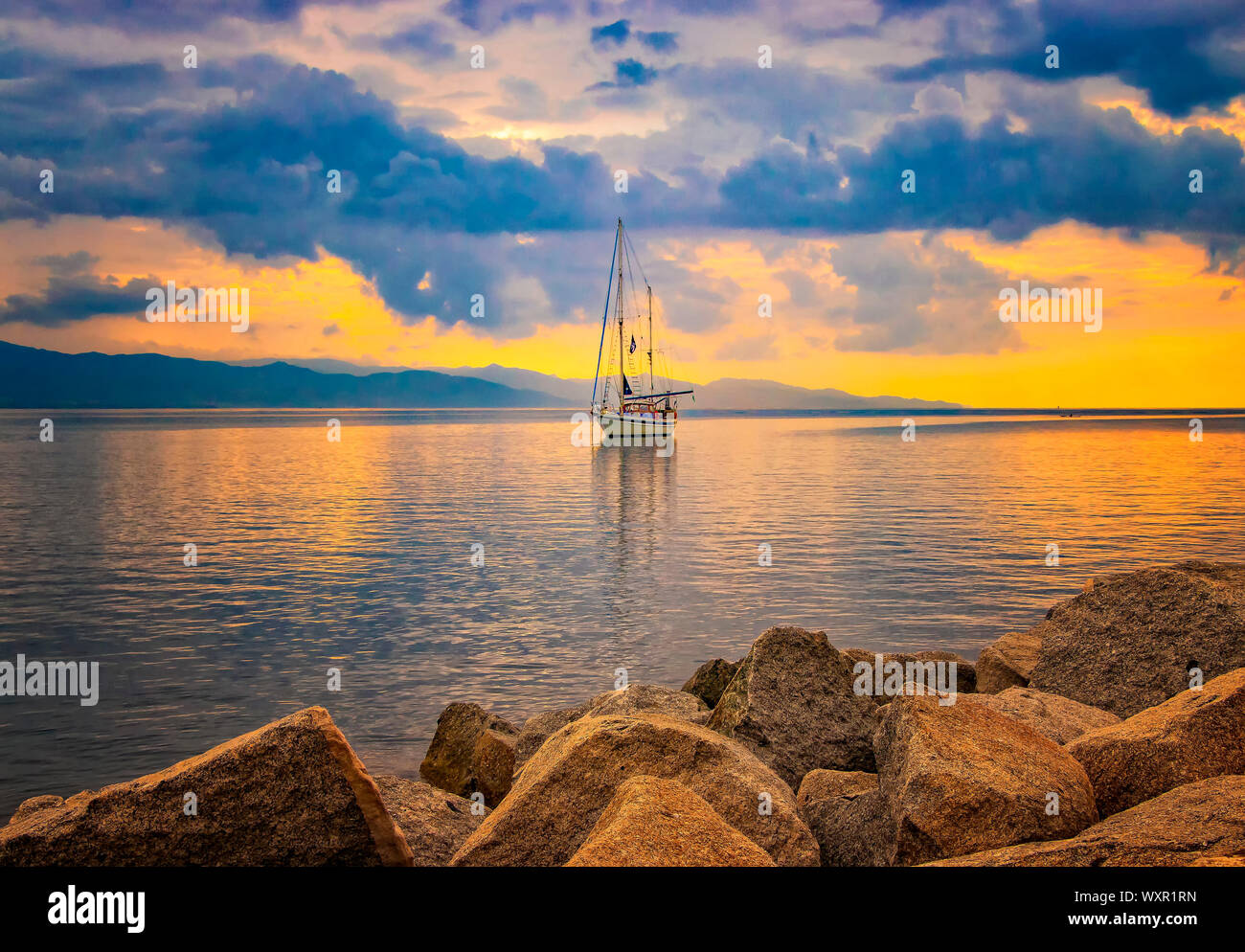 Natural Background With Yacht In The Mediterranean Sea At Sunrise Cagliari Italy He Sun Illuminates The Island With Beautiful Golden Colors Stock Photo Alamy