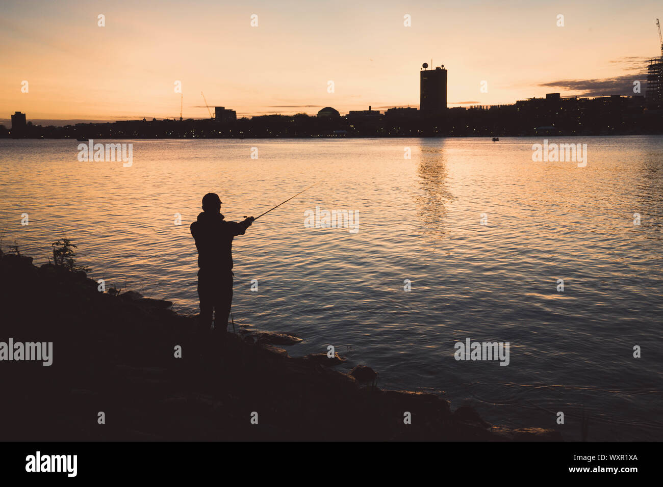 Fishing at wonderful Charles river at sunset(Boston Charles River Stock