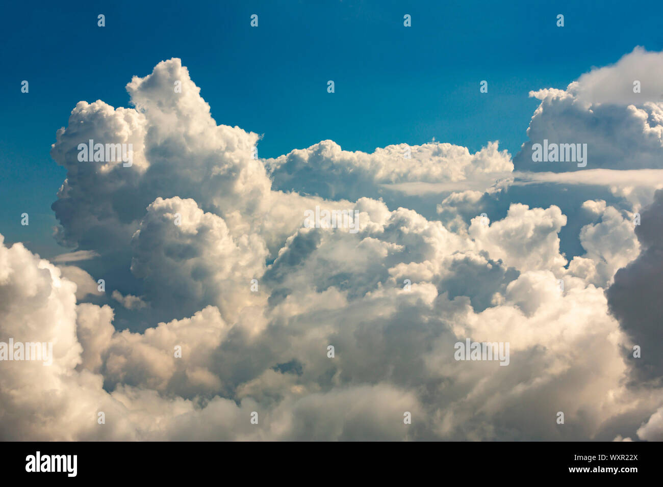 White clouds are seen against the blue sky. Stock Photo