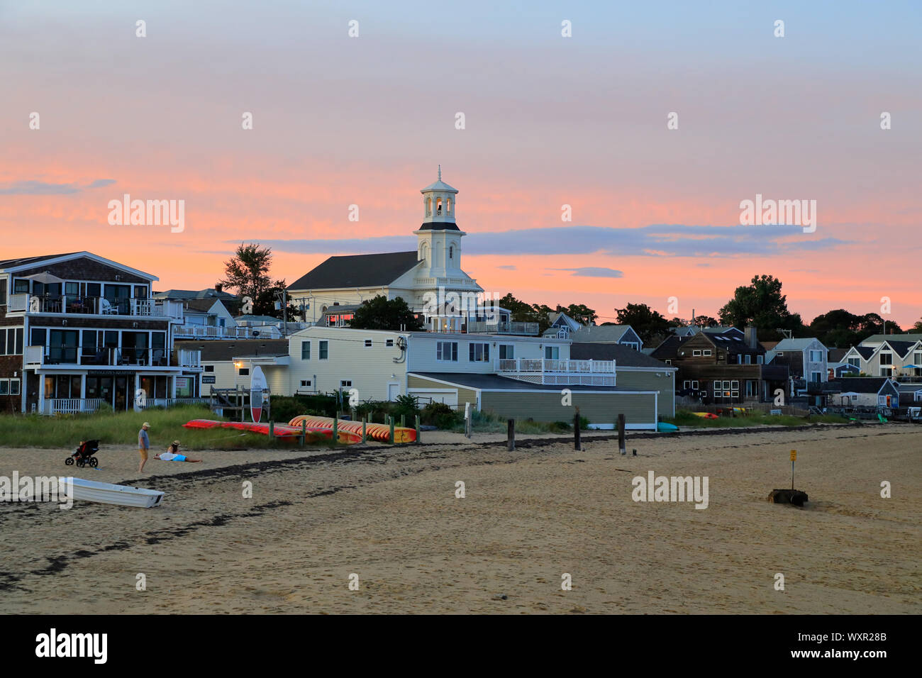 Low tide beach of Provincetown during dusk hour with Public Library aka