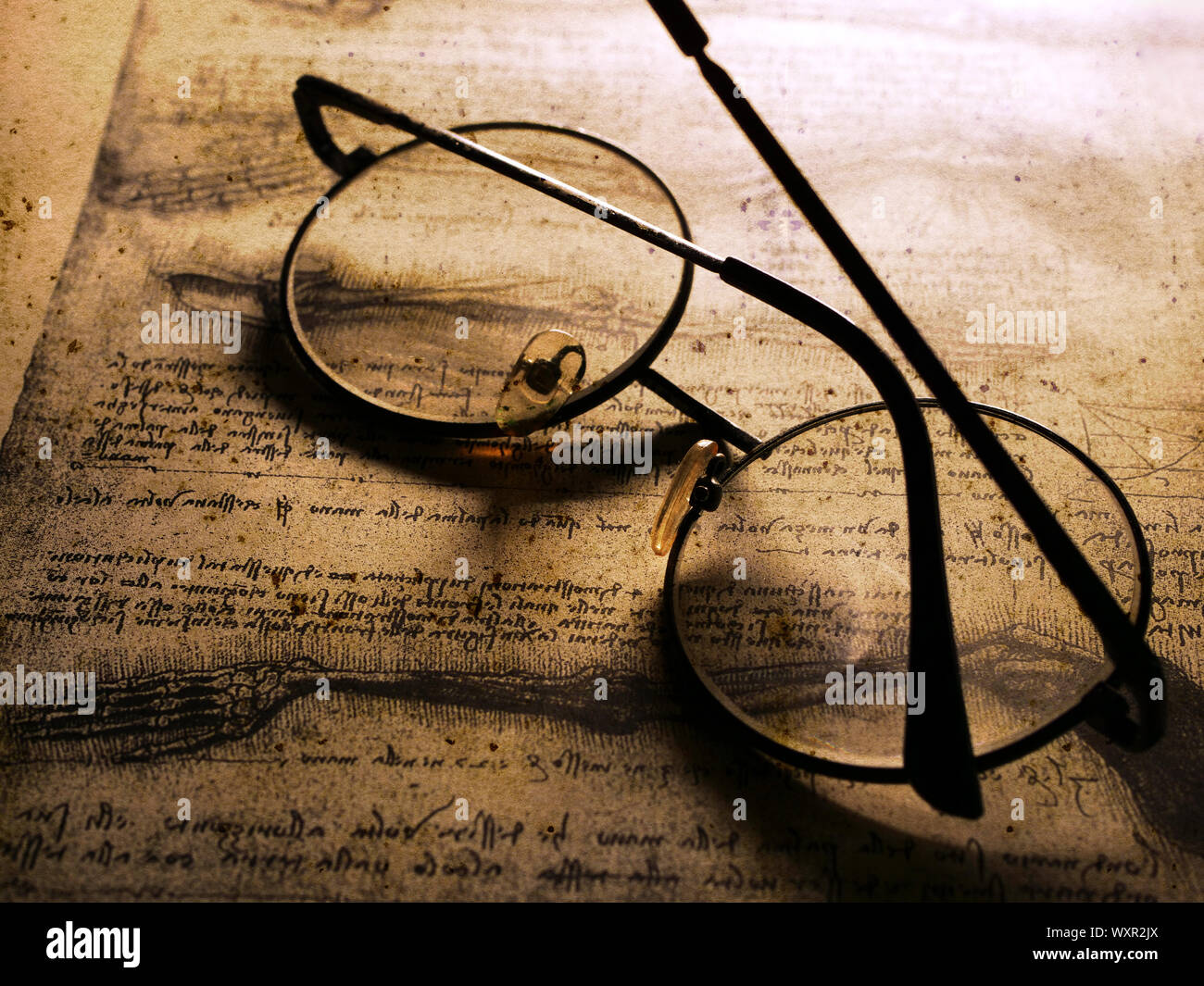 Close up of old classic spectacles on a book background Stock Photo