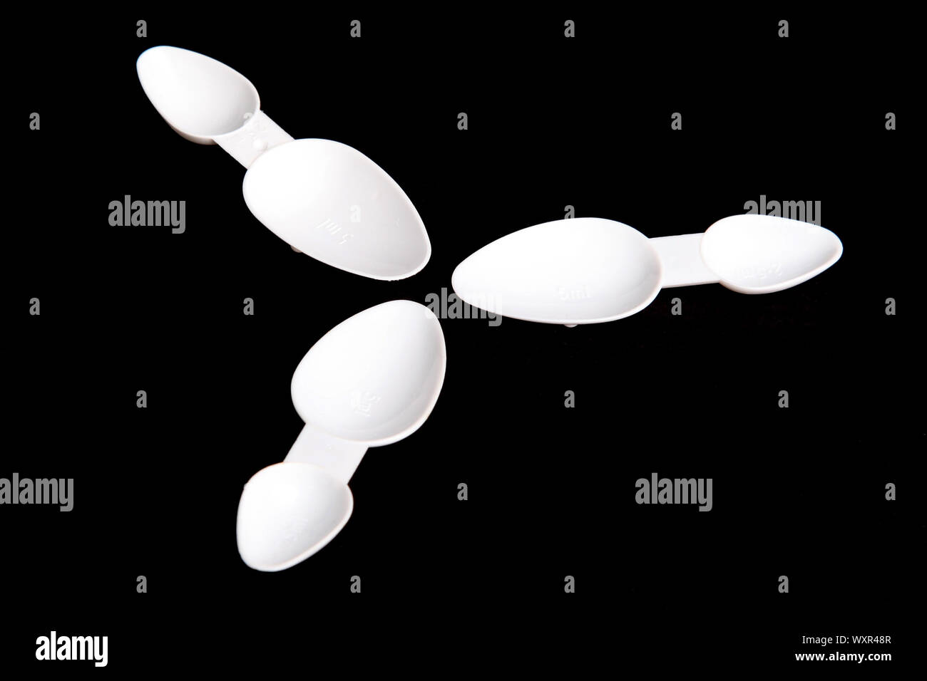 Plastic medicine measuring spoons hires stock photography and images Alamy