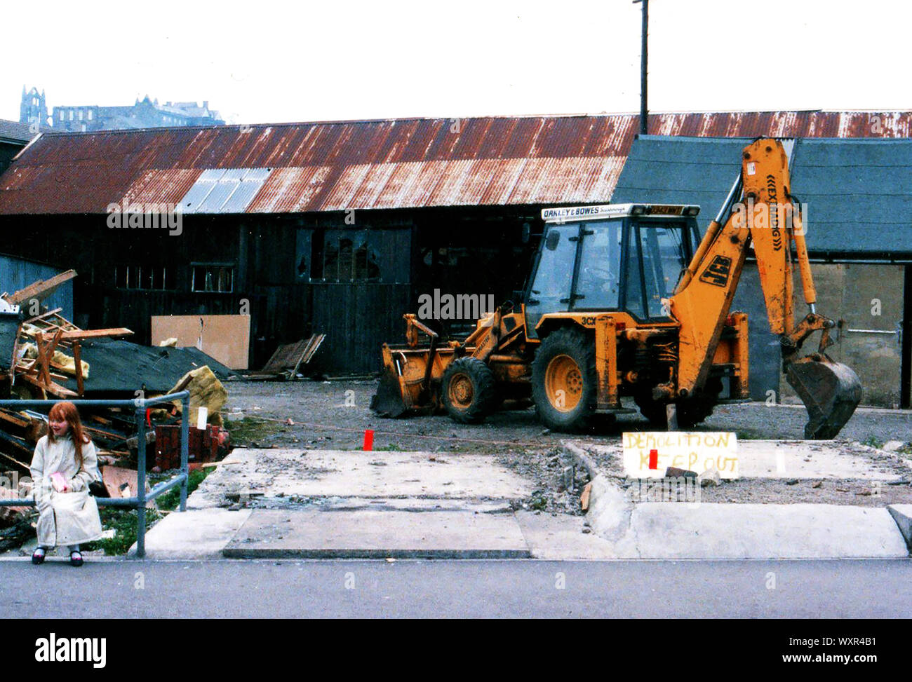 A photograph taken shortly before the demolition of Whitby Sawmill, Dock End, Whitby, Yorkshire UK by a Utemaster digger with extradig shovel.. The Dock End area was under redevelopment and is  now covered by the former tourist information office (Now the Star Inn Restaurant by the Harbour) and other facilities. Stock Photo