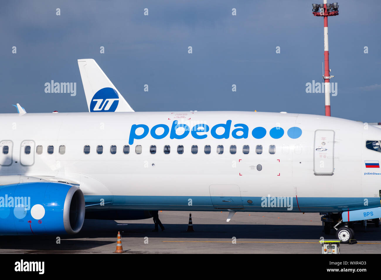 Russia Moscow 2019-06-17 Boeing 737 Pobeda Airlines russian company low cost price arrived to airport, standing on airplane parking, landing strip Stock Photo