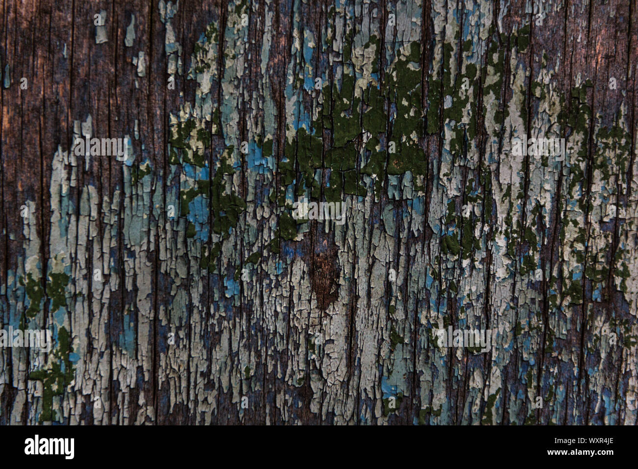 Cracking and peeling paint on a wall Stock Photo