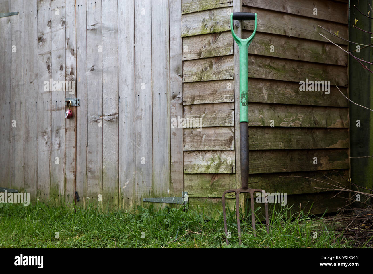 Old garden shed with old rusting garden fork Stock Photo Alamy