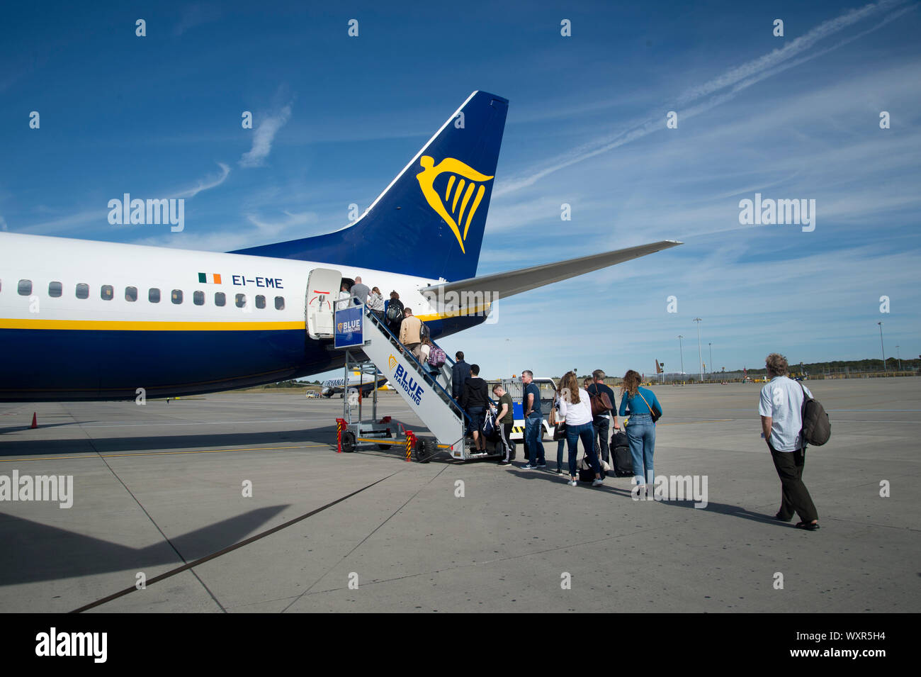 Essex, UK. Stansted airport. Passengers board a Ryan Air flight to Aarhus, Denmark. Stock Photo