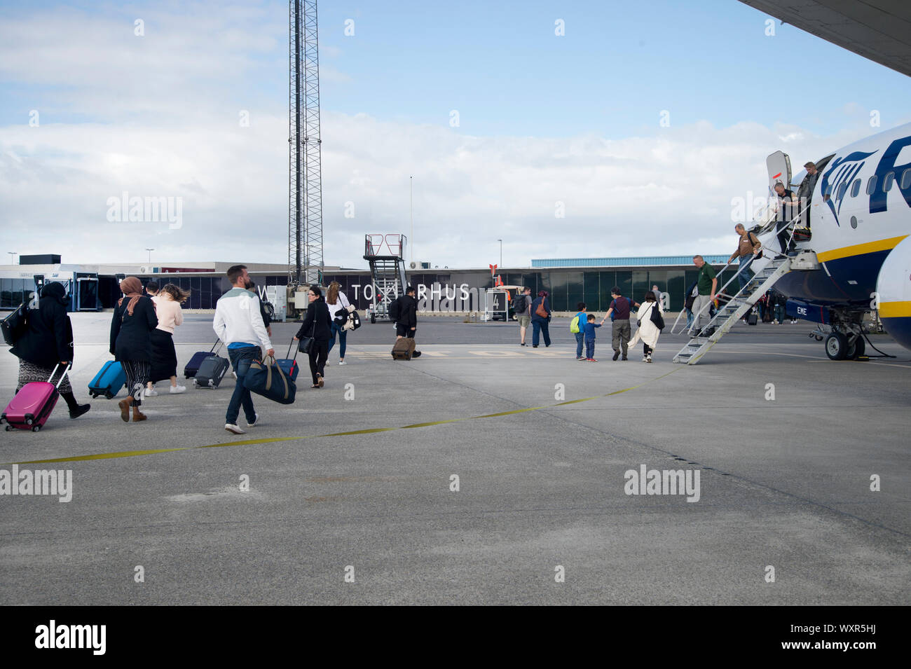 Aarhus, Denmark. Passengers get off a Ryan Air flight from Stansted. Stock Photo
