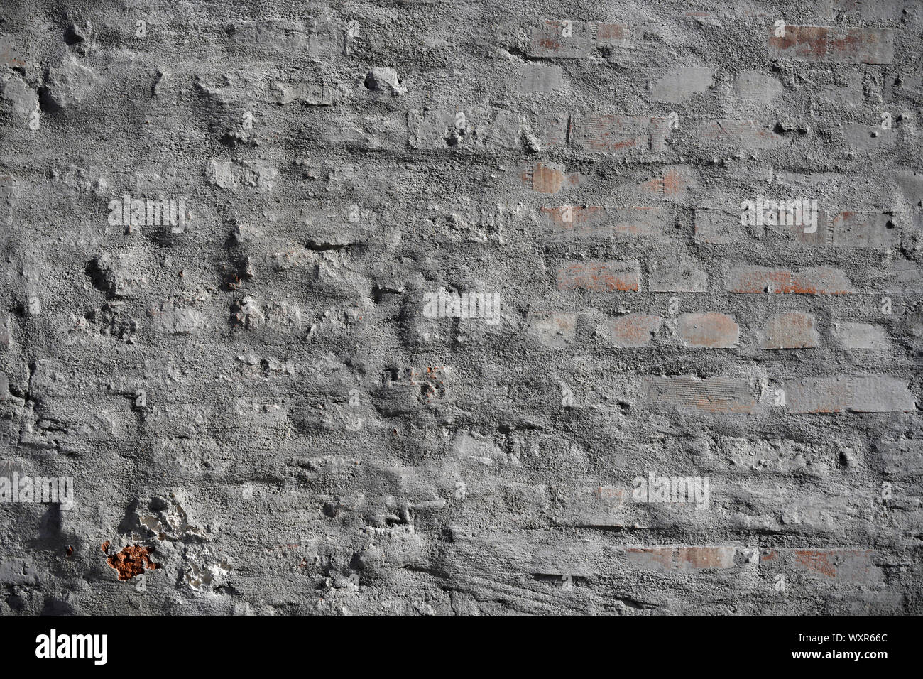 Old vintage cracked bricks with concrete texture. Stock Photo