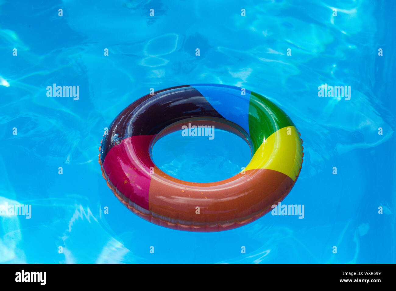 Premium Photo | Close up yellow swimming pool ring float in blue water