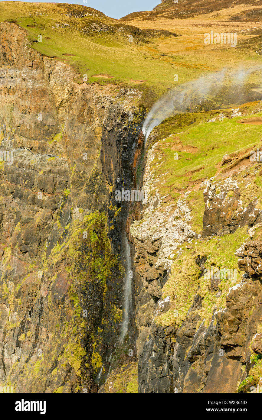 The Allt Mheididh waterfall with spray being blown upwards by the wind, Talisker Bay, Minginish, Isle of Skye, Scotland, UK Stock Photo