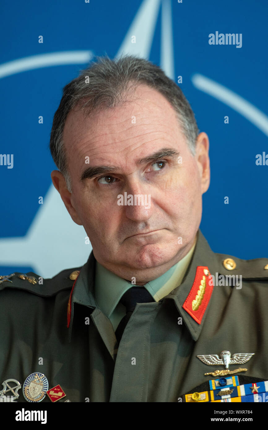 Ulm, Germany. 17th Sep, 2019. The representative of NATO headquarters General Vasileios Gampis sits in front of the NATO logo. At a two-day meeting, representatives of the NATO States discussed the establishment of the NATO Command for Rapid Movement of Troops and Material (JSEC) in Ulm. At a two-day meeting, representatives of the NATO States discussed the establishment of the NATO Command for Rapid Movement of Troops and Material (JSEC - Joint Support and Enabling Command). Credit: Stefan Puchner/dpa/Alamy Live News Stock Photo