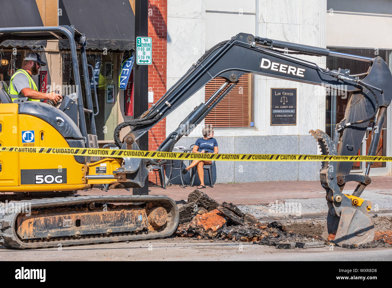 HICKORY, NC, USA13 SEPT 2019 A Deere tractor with backhoe breaks up