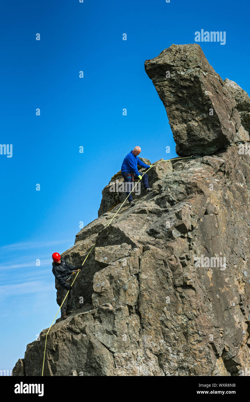 Climbers abseiling off the Inaccessible Pinnacle, at the summit of Sgurr Dearg, Cuillin mountains, Minginish, Isle of Skye, Scotland, UK Stock Photo