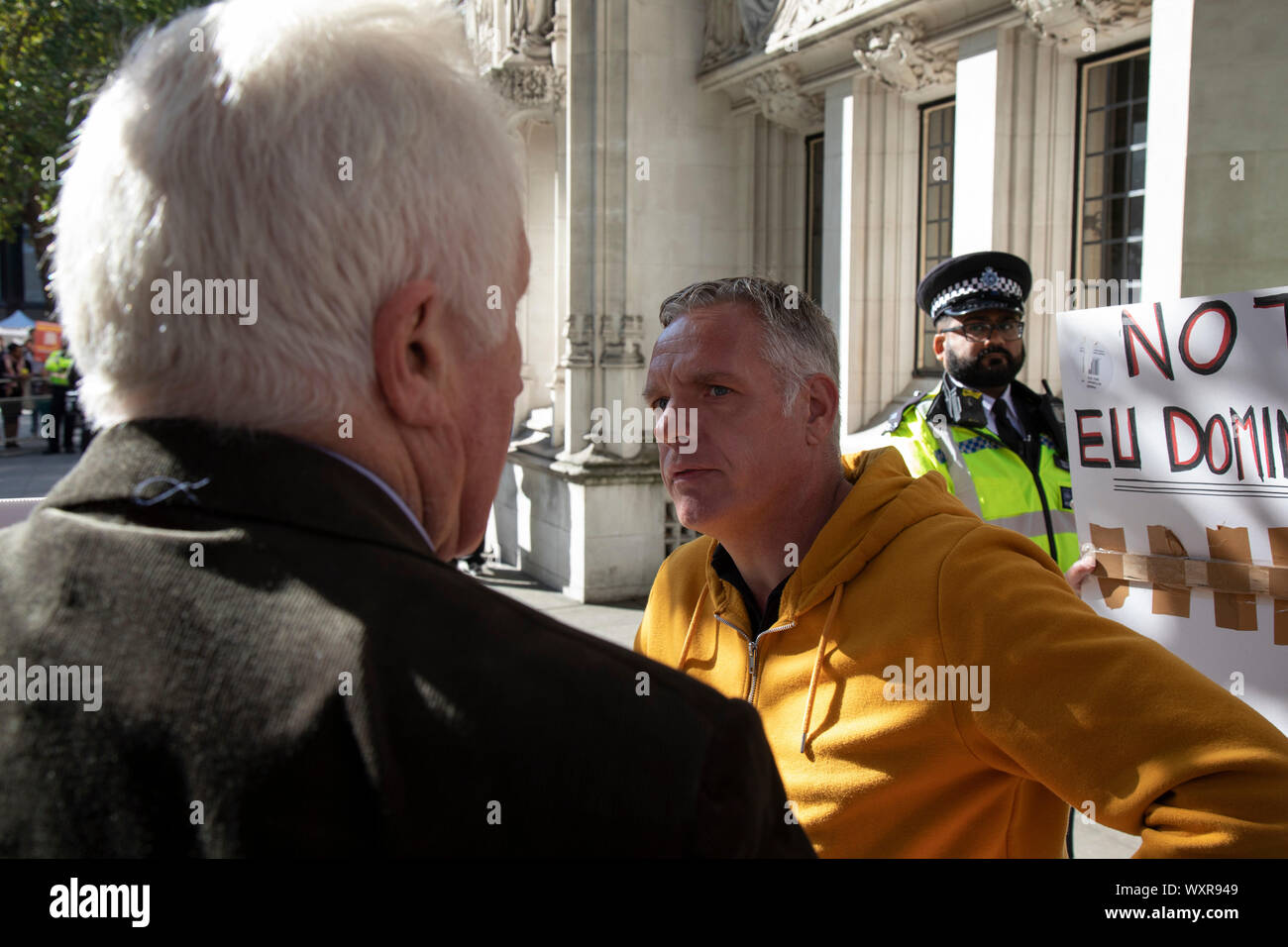 Television presenter and broadcaster David Dimbleby speaks to pro-leave protesters outside The Supreme Court as the first day of the hearing to rule on the legality of suspending or proroguing Parliament begins on September 17th 2019 in London, United Kingdom. The ruling will be made by 11 judges in the coming days to determine if the action of Prime Minister Boris Johnson to suspend parliament and his advice to do so given to the Queen was unlawful. David Dimbleby is a British journalist and former presenter of current affairs and political programmes, now best known for the BBCs long-running Stock Photo