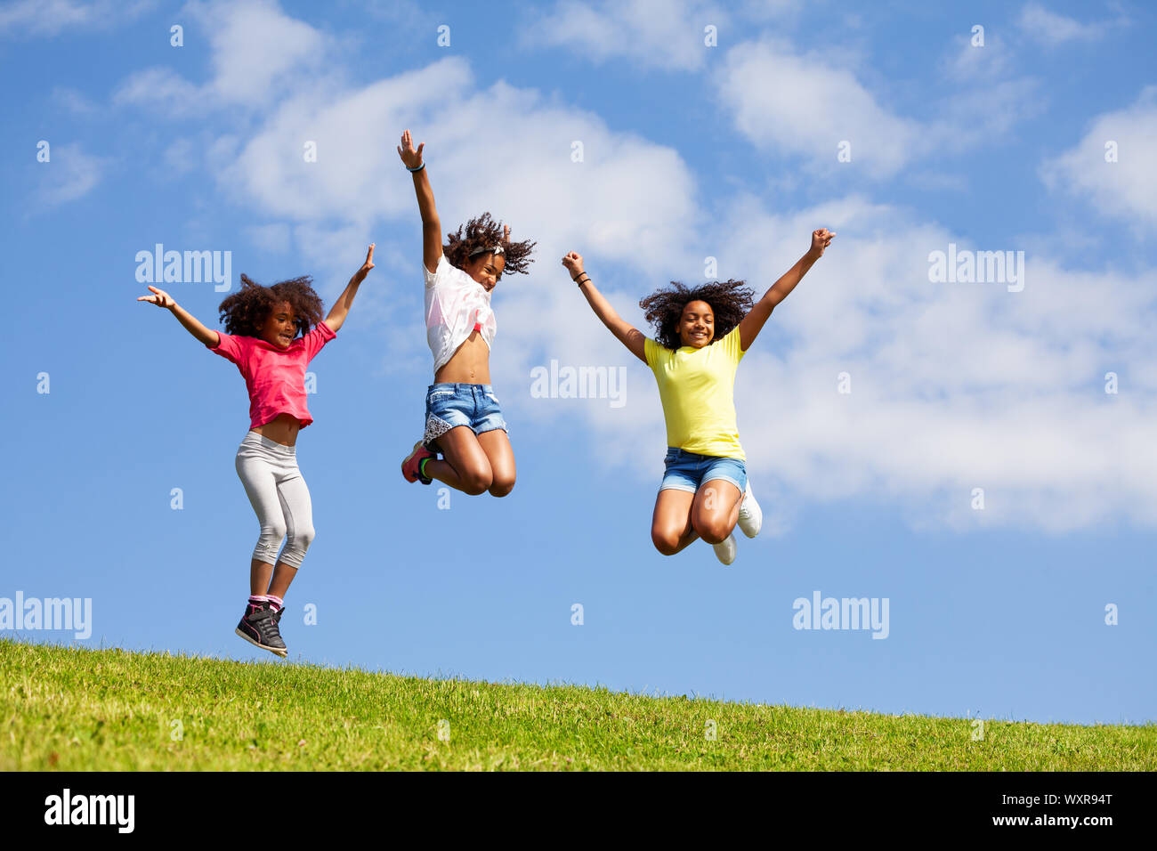 Kids jump hi-res stock photography and images - Alamy