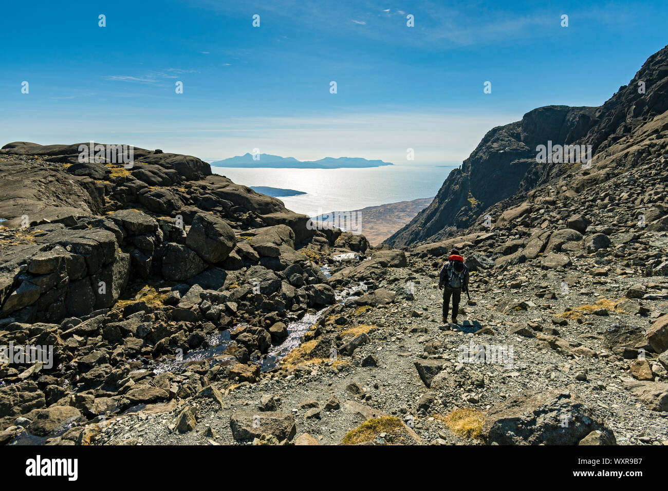 The island of Rum from the lip of Coir' a'Ghrunnda in the Cuillin mountains, Isle of Skye, Scotland, UK Stock Photo