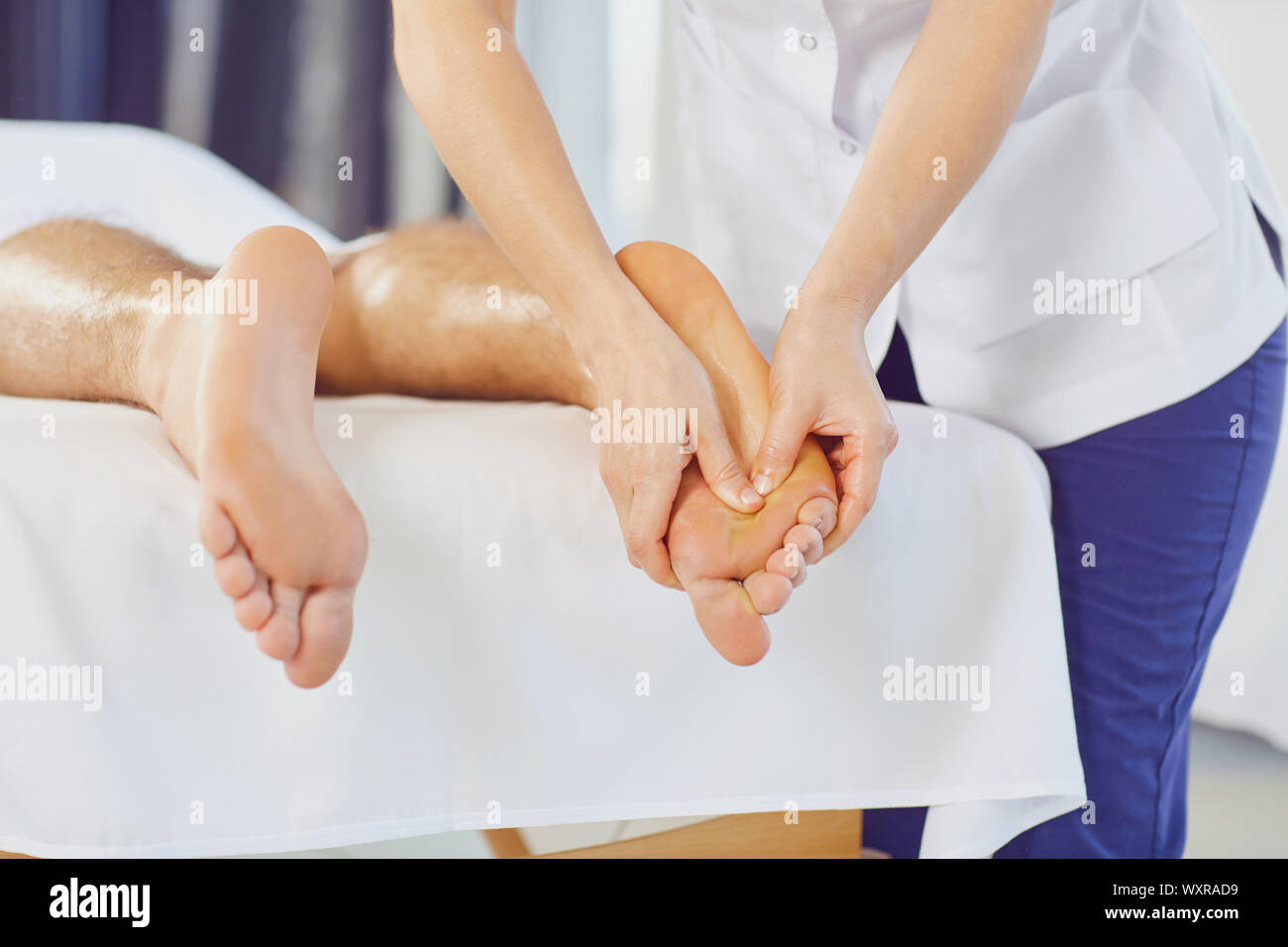 Foot massage in the spa salon. Stock Photo
