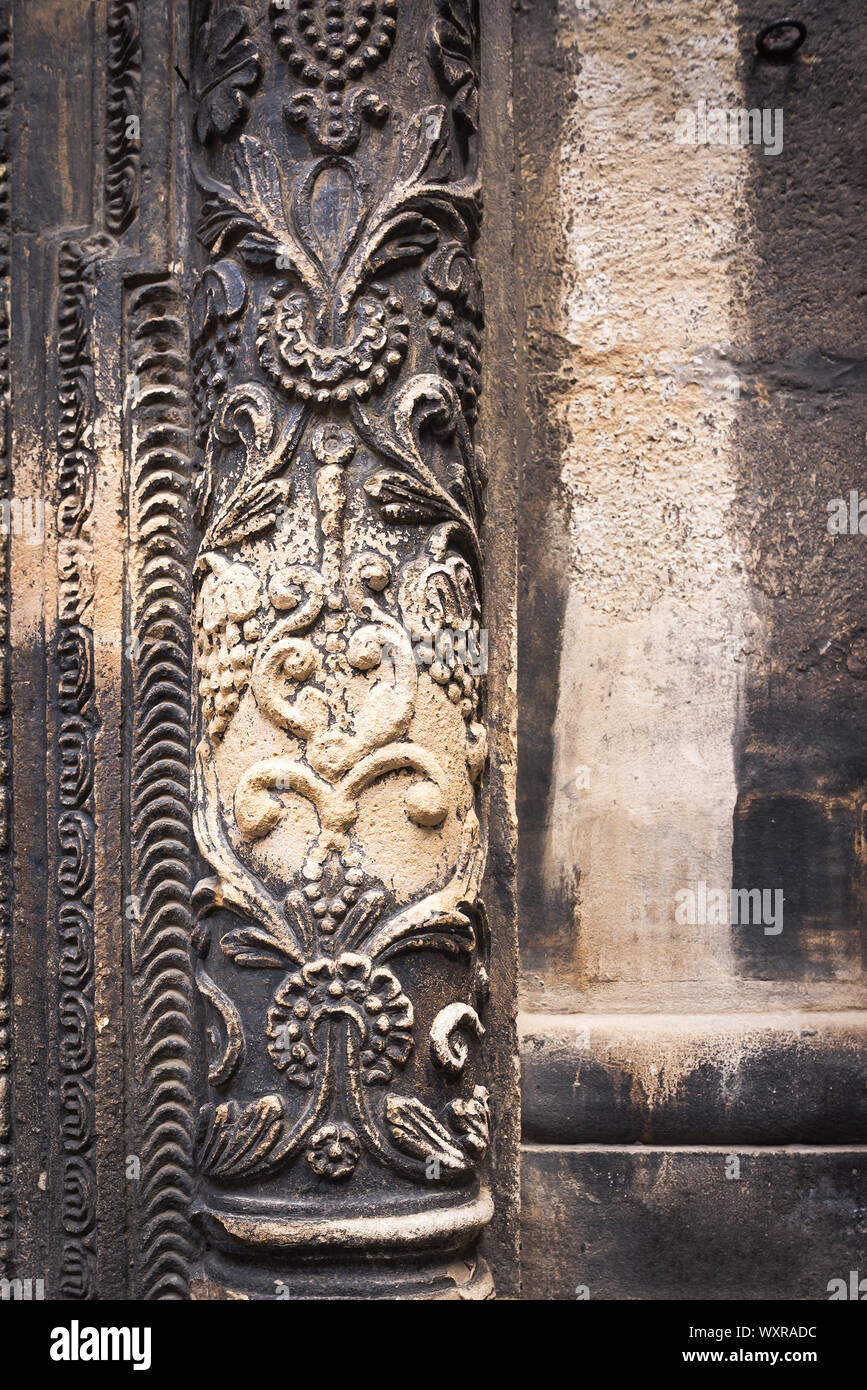 Ancient columns with Renaissance bas-reliefs and plants patterns in the ...