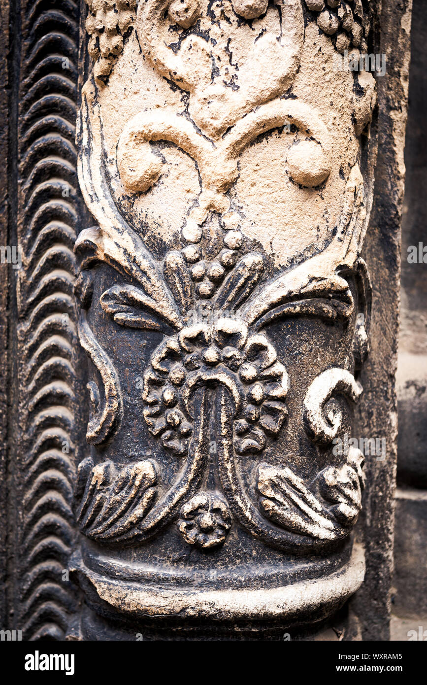 Ancient columns with Renaissance bas-reliefs and plants patterns in the ...