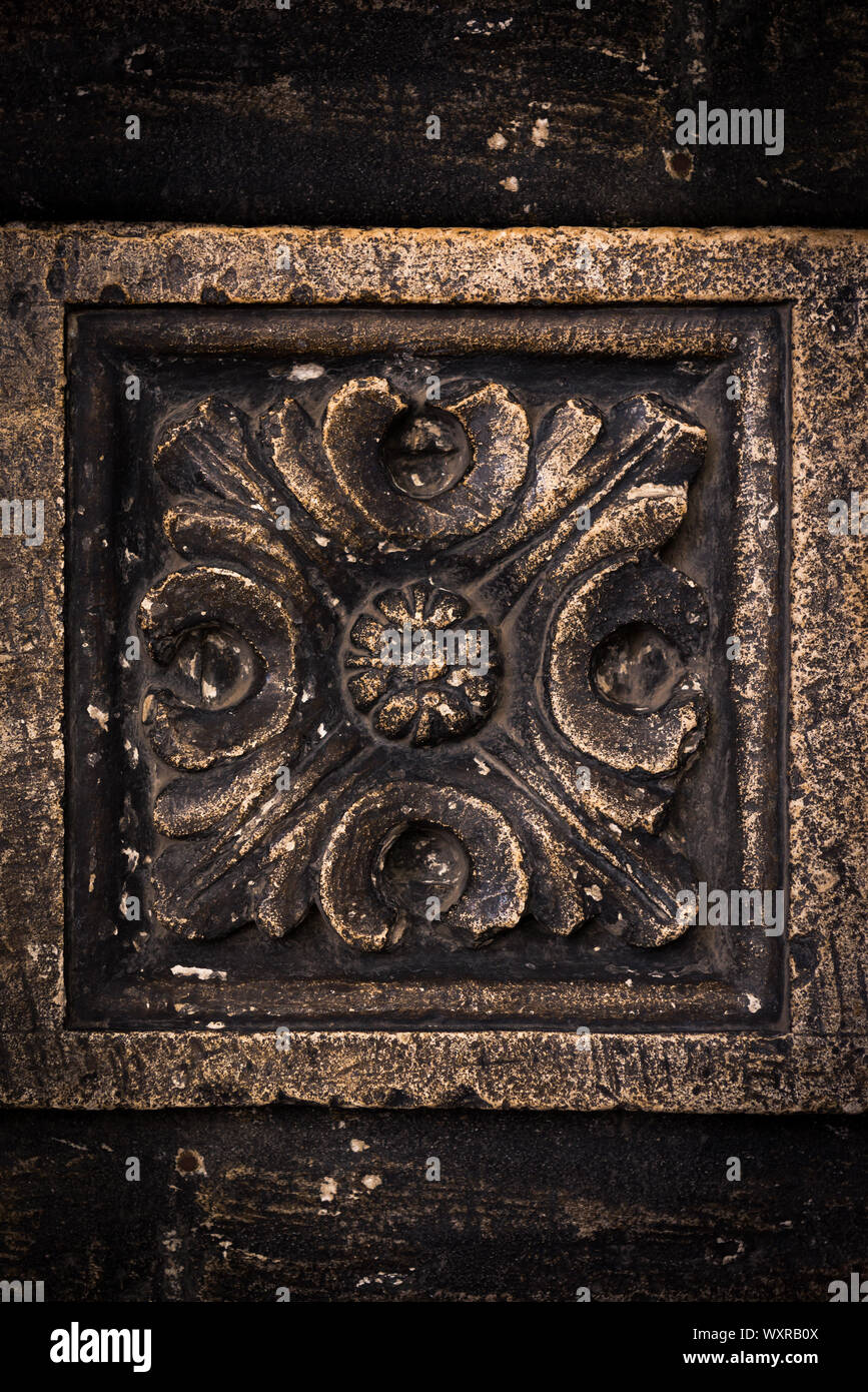 Ancient columns with Renaissance bas-reliefs and plants patterns in the ...