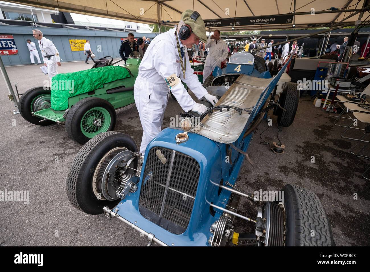 Vintage cars from the 1930's to the 1950's in the paddock during the Goodwood Revival car festival, UK. Stock Photo