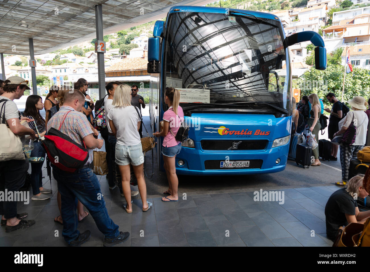 Tourists and local people boarding a Croatia Bus coach at Dubrovnik bus Station, Gruz, Croatia Europe Stock Photo