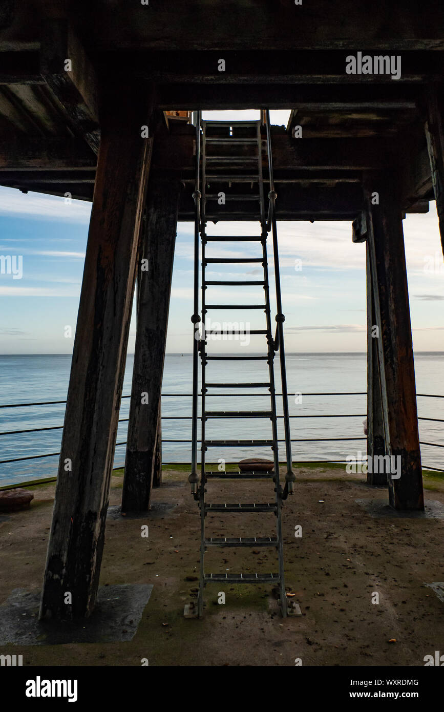 Ladder from the lower level of a pier to the upper level at Whitby, England. Stock Photo