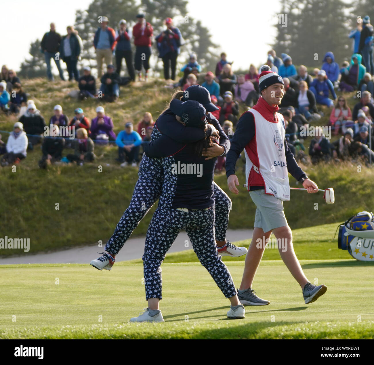 Solheim Cup 2019 at Centenary Course at Gleneagles in Scotland, UK. Lizette Salas of USA  is congratulated by Angel Lin (r) on 18th green after winning match. Stock Photo