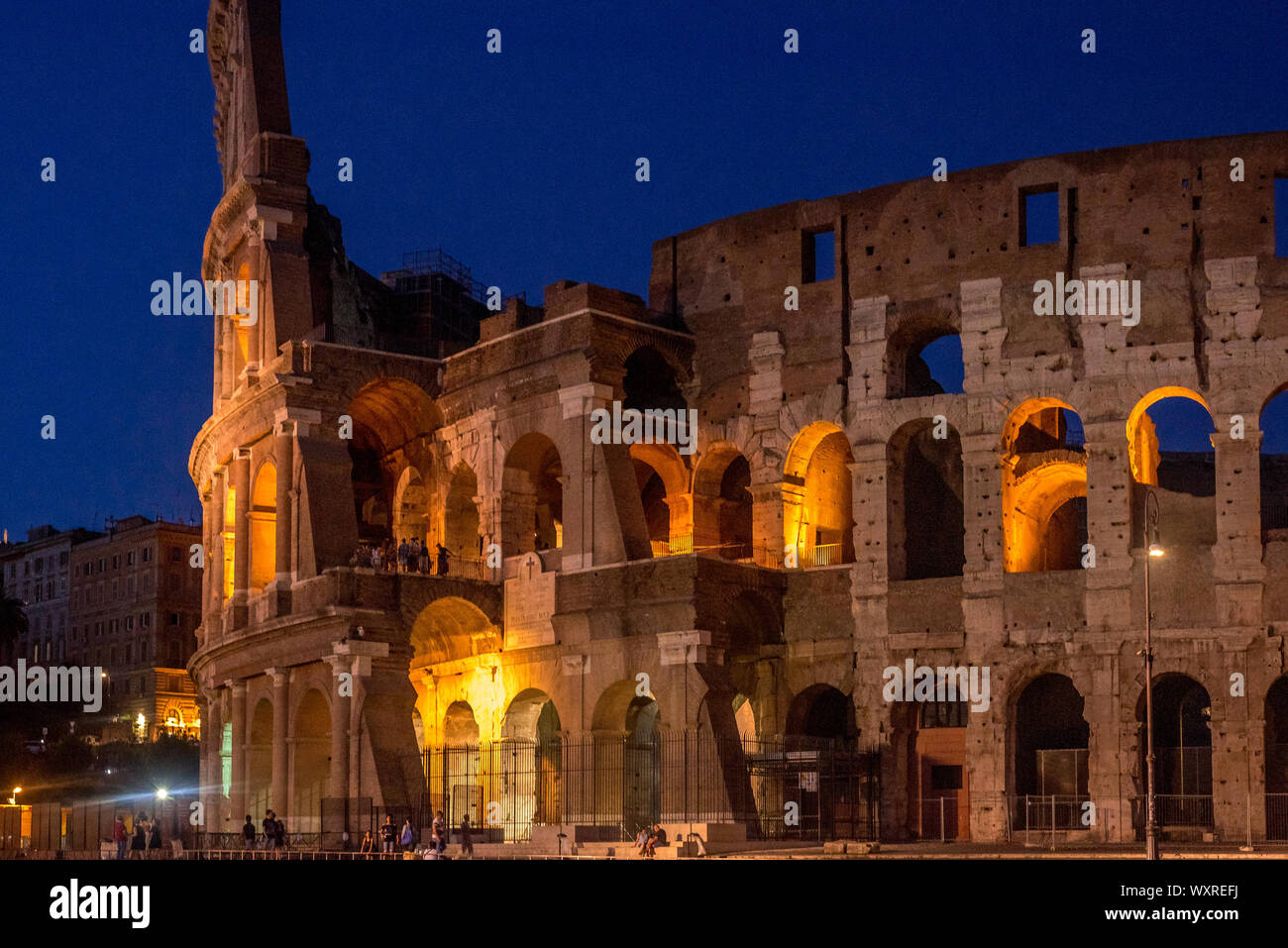 Rome, Italy - July 16, 2019: The Colosseum under the glow of lights at night, Rome Stock Photo