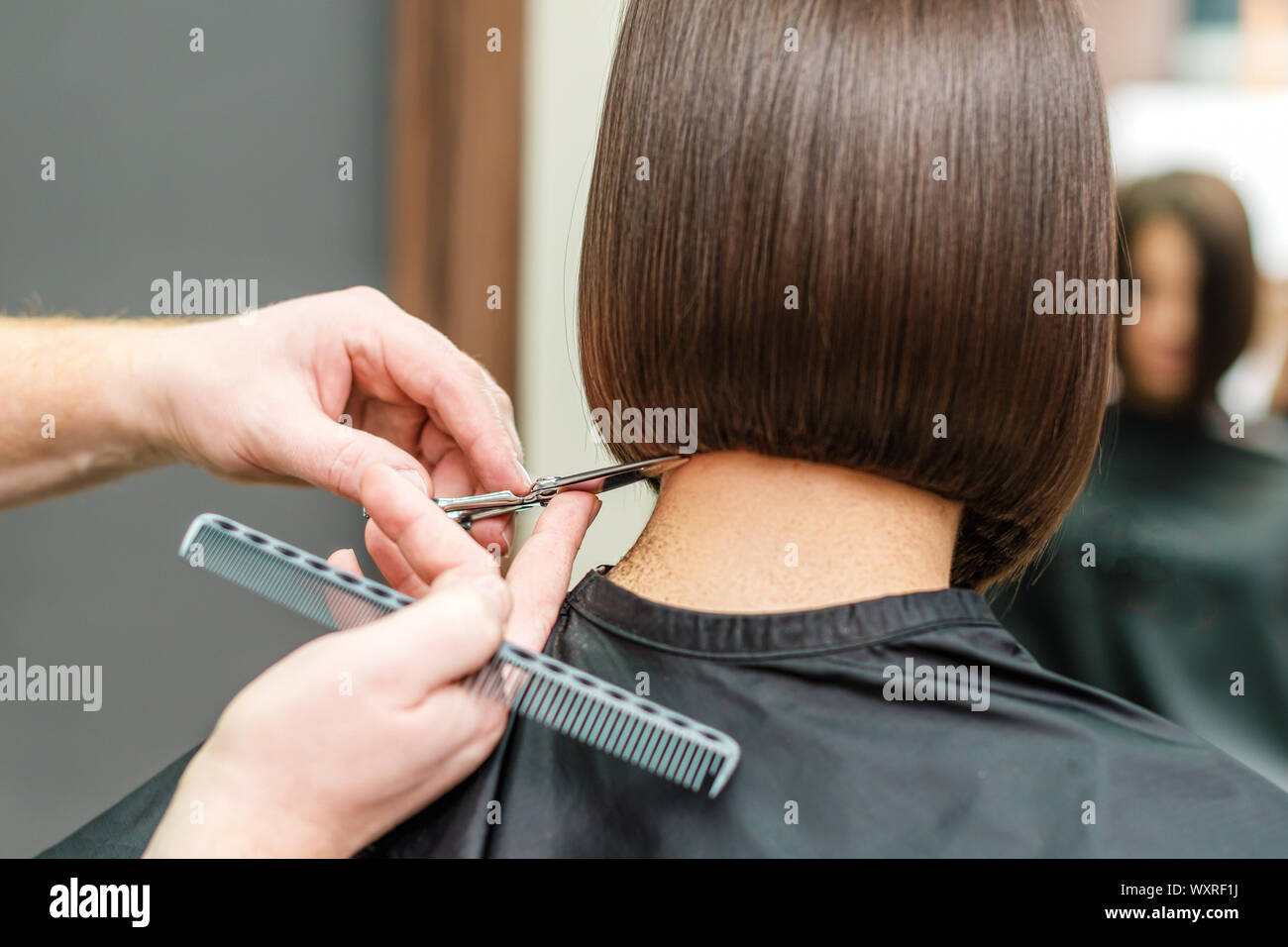 close up hands of professional hair stylist are making short hair with  scissors and comb, concept beauty salon, female hairdresser Stock Photo -  Alamy