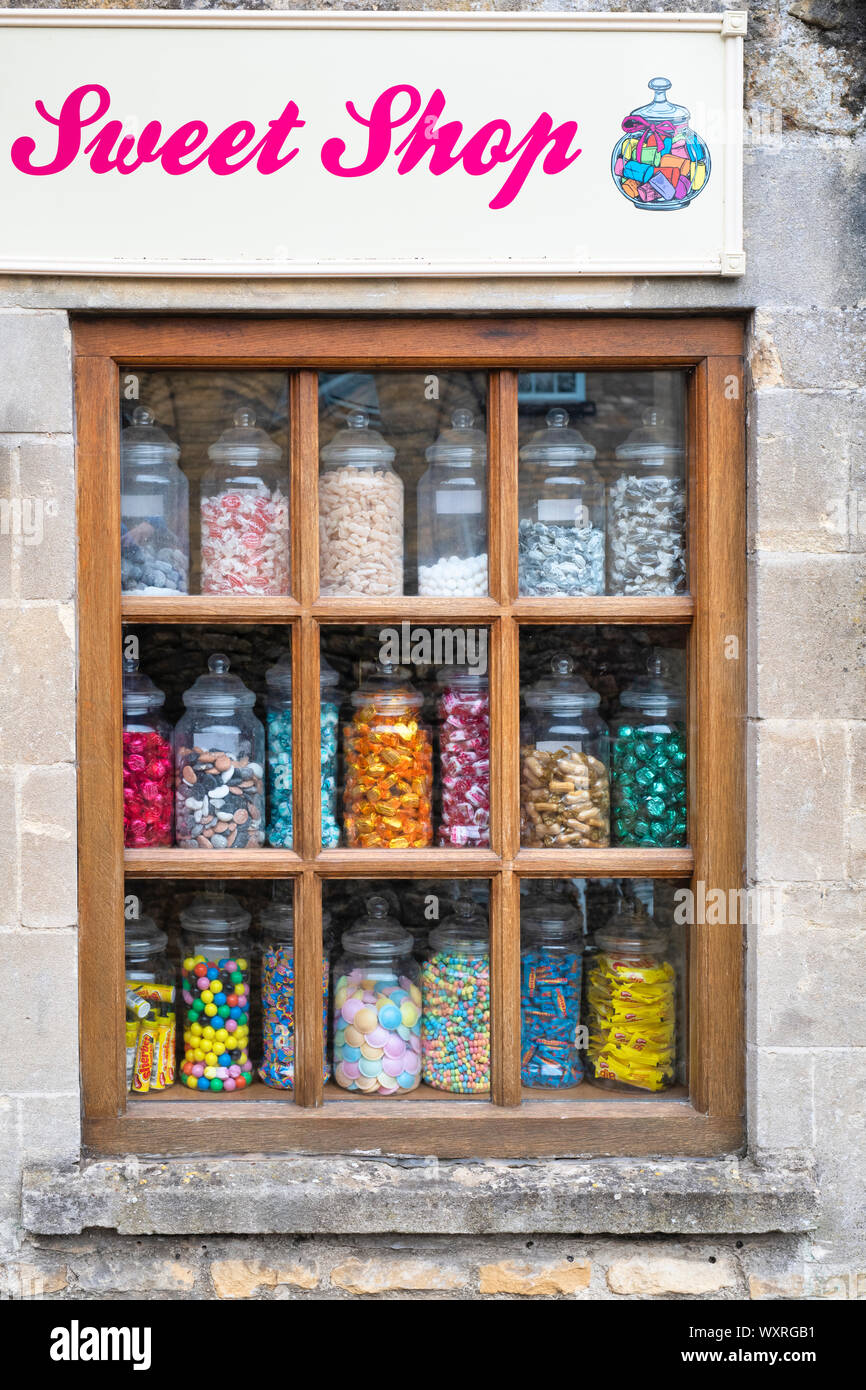 Jars of sweets in the window of Garlands little sweet shop. Bourton on the Water, Cotswolds, Gloucestershire, England Stock Photo