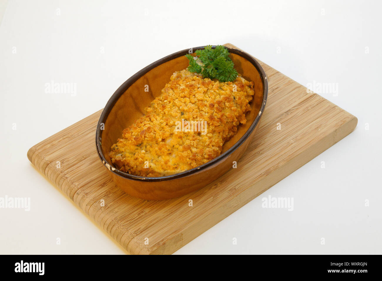 Saithe fish fillet with herb crust Stock Photo
