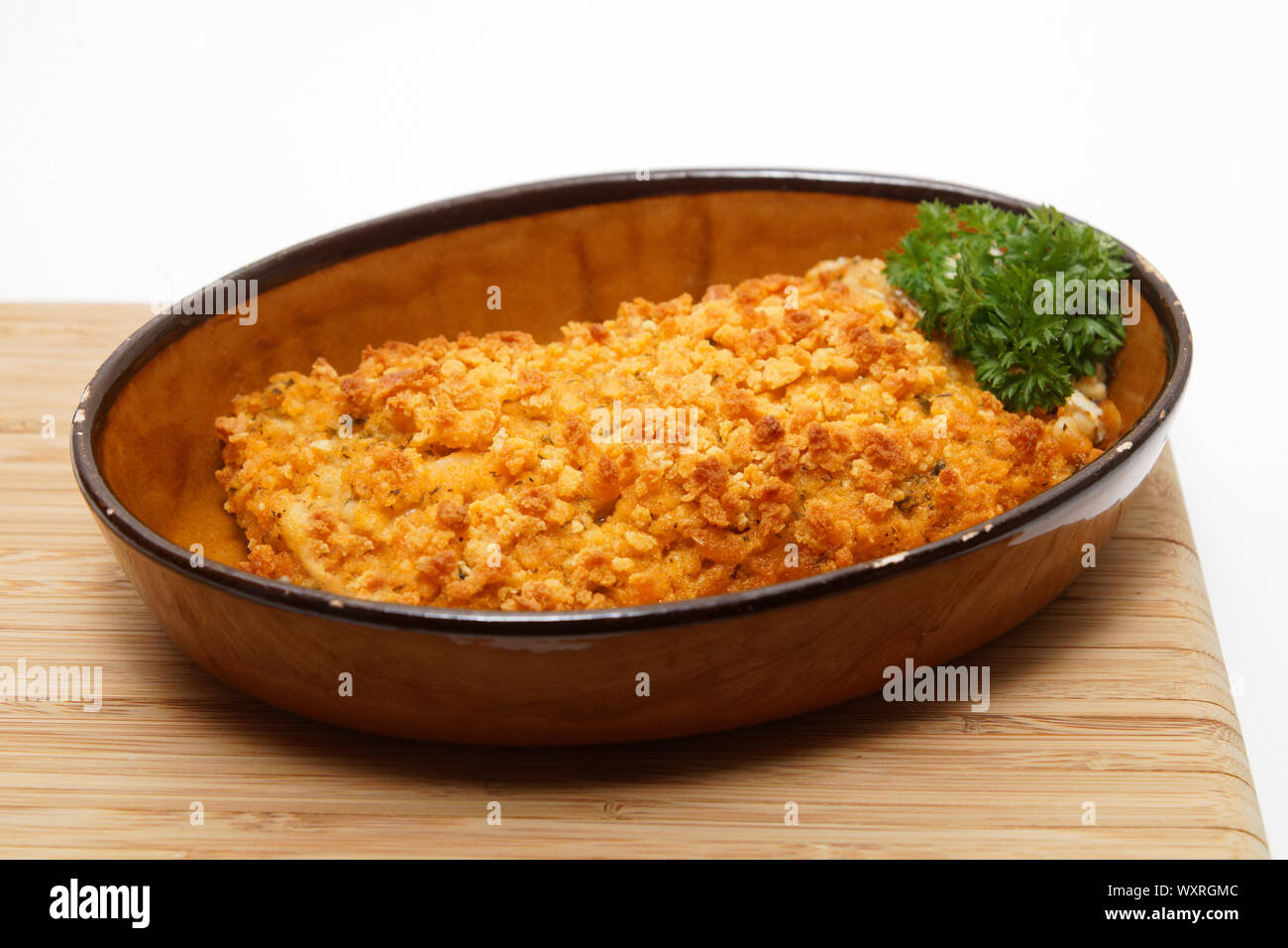 Saithe fish fillet with herb crust Stock Photo - Alamy