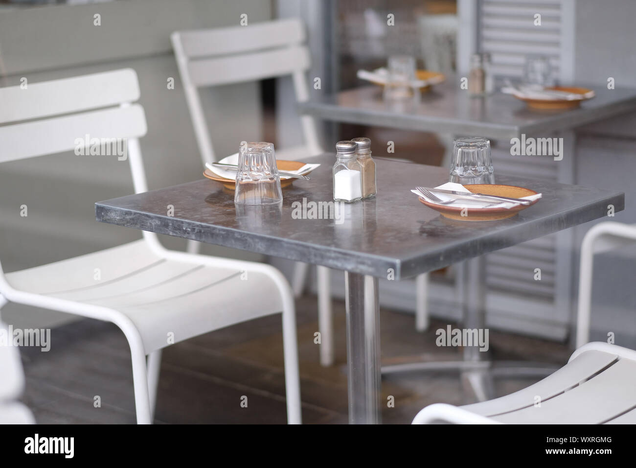 Served tables in a cafe waiting for visitors Stock Photo