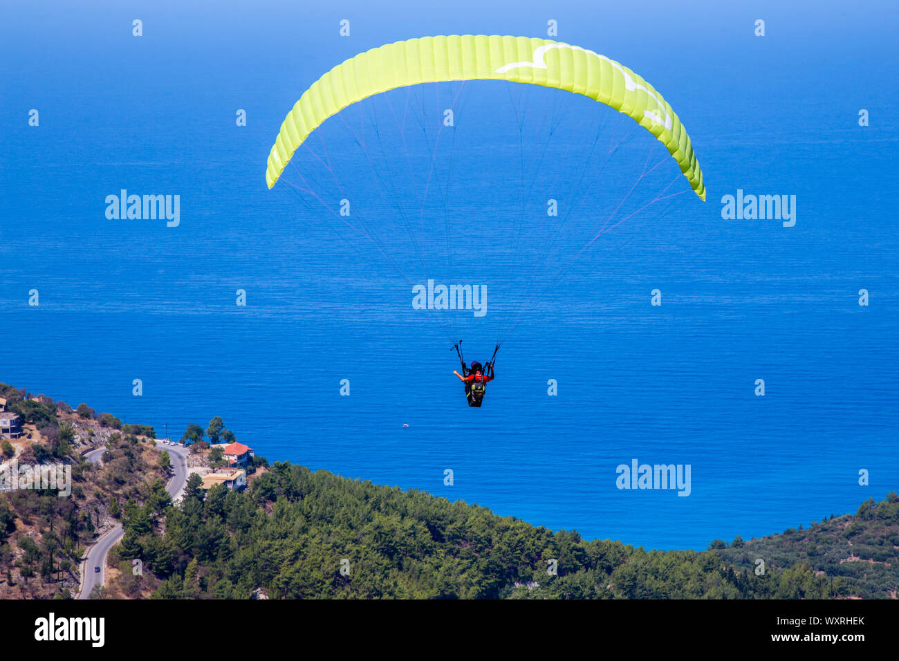 Tandem paragliding from Exanthia on Lefkada / Lefkas Island, Greece Stock Photo