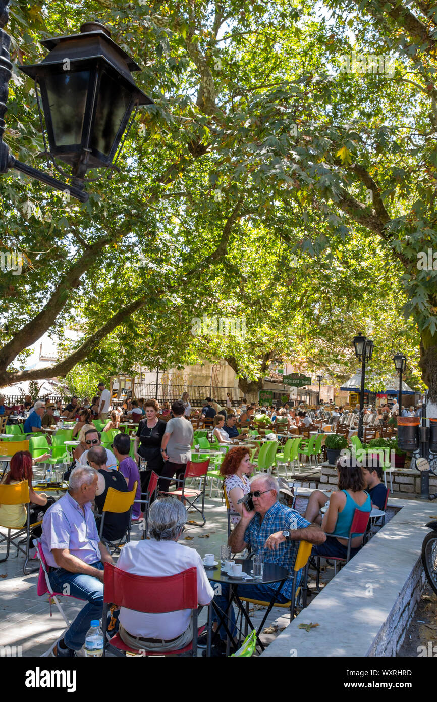 Tavernas under the plane trees in Karya town, Lefkada / Lefkas Island, Greece Stock Photo