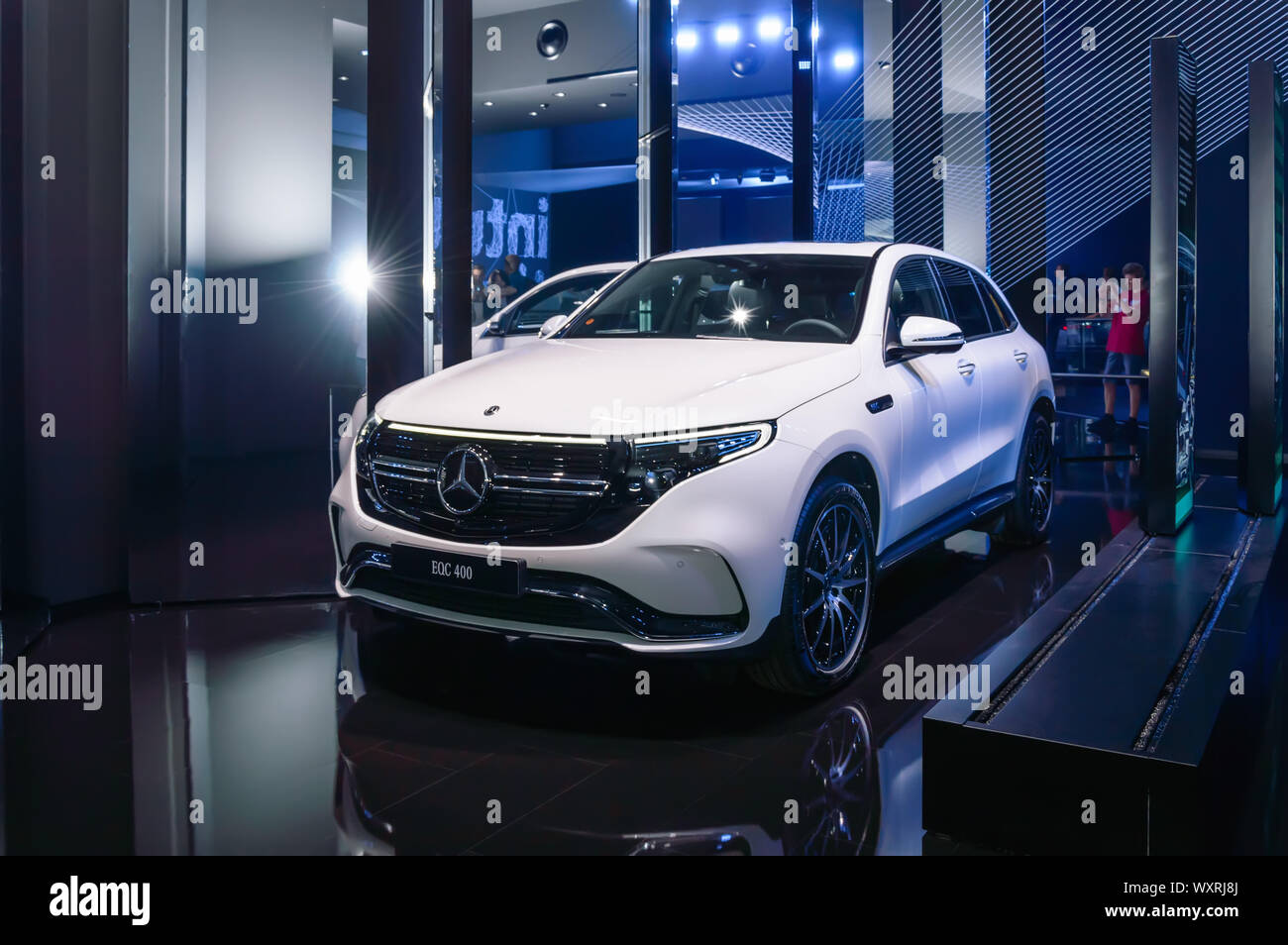 FRANKFURT - SEP 15, 2019: White Mercedes-Benz EQC 400 4Matic compact SUV - fully electric luxury car at IAA 2019 International Motor Show, new product Stock Photo