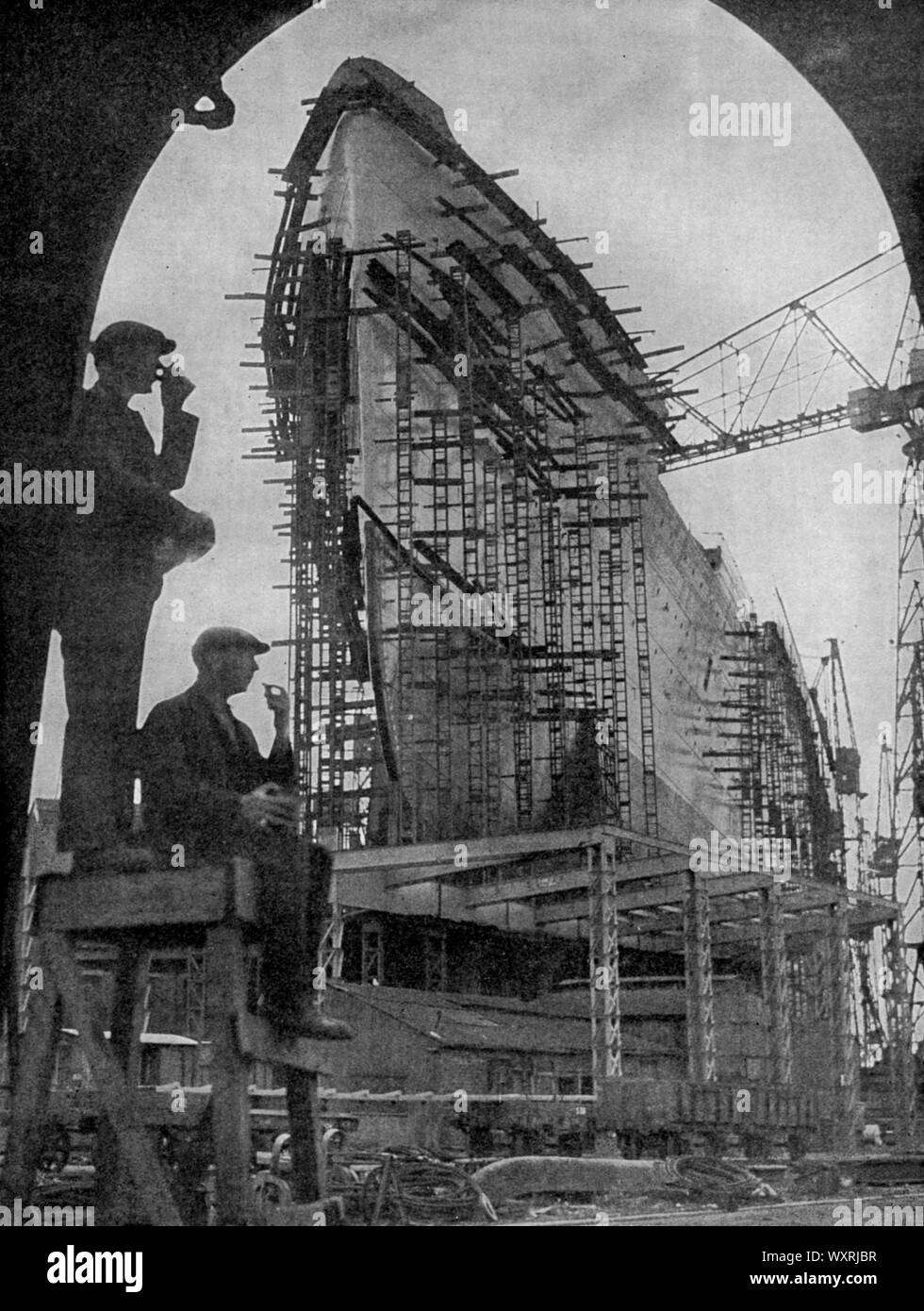 The building of the RMS Queen Mary, 1934. The RMS Queen Mary, British ocean liner that sailed primarily on the North Atlantic Ocean from 1936 to 1967 for the Cunard-White Star Line. Here we see her at the shipbuilders John Brown & Company, Clydebank, Scotland. Stock Photo