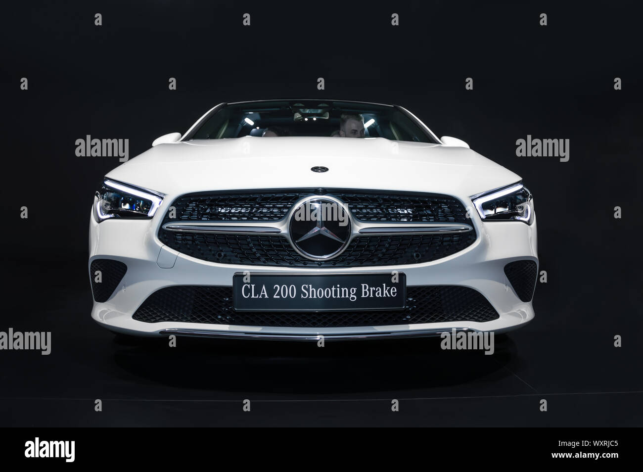 FRANKFURT - SEP 15, 2019: white Mercedes-Benz CLA 200 Shooting Brake at IAA 2019 International Motor Show, compact luxury car. Front view with headlig Stock Photo