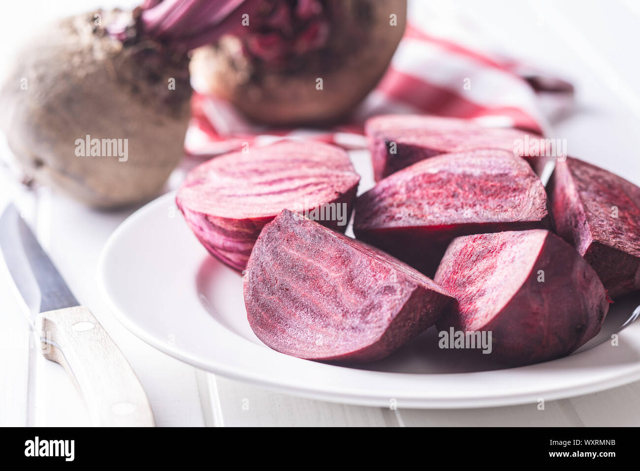 Tasty raw beetroot. Sliced beetroot on plate. Stock Photo