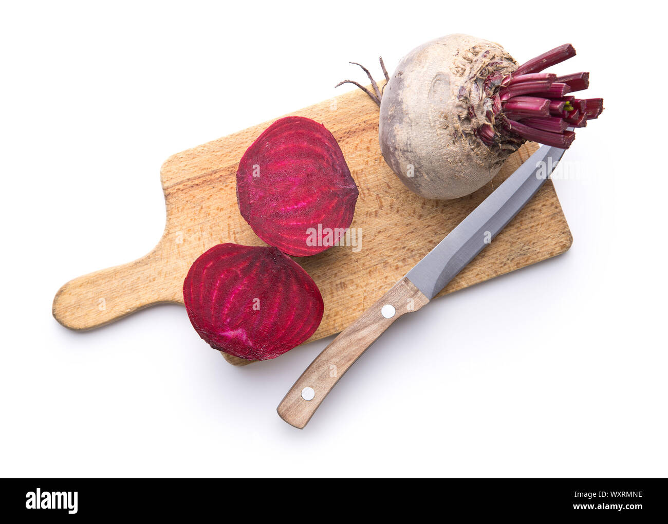 Tasty raw beetroot. Sliced beetroot on cutting board isolated on white background. Stock Photo