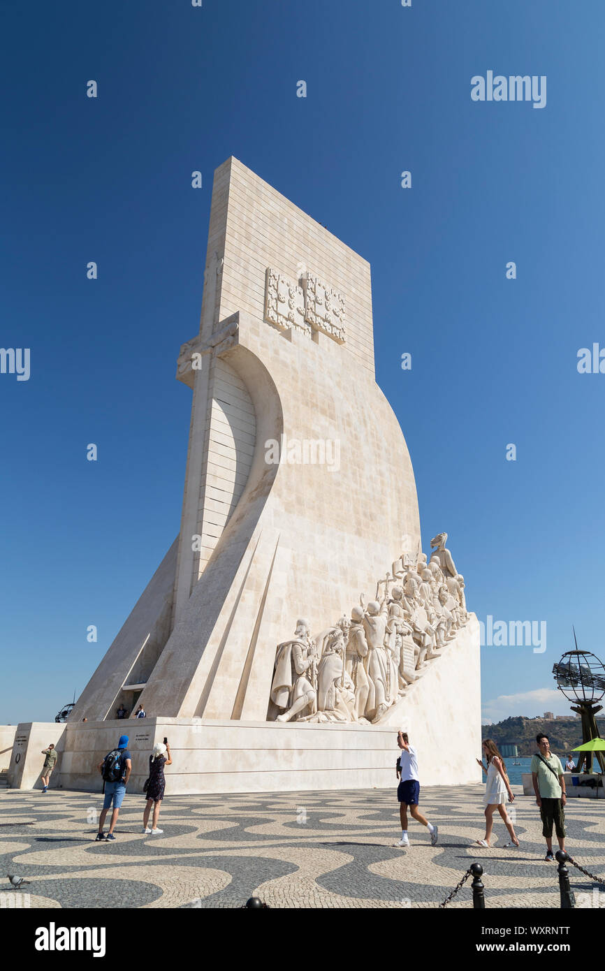 Tourists at the Padrao dos Descobrimentos (Monument to the Discoveries) monument on the edge of the Tagus River in Belem district in Lisbon, Portugal. Stock Photo