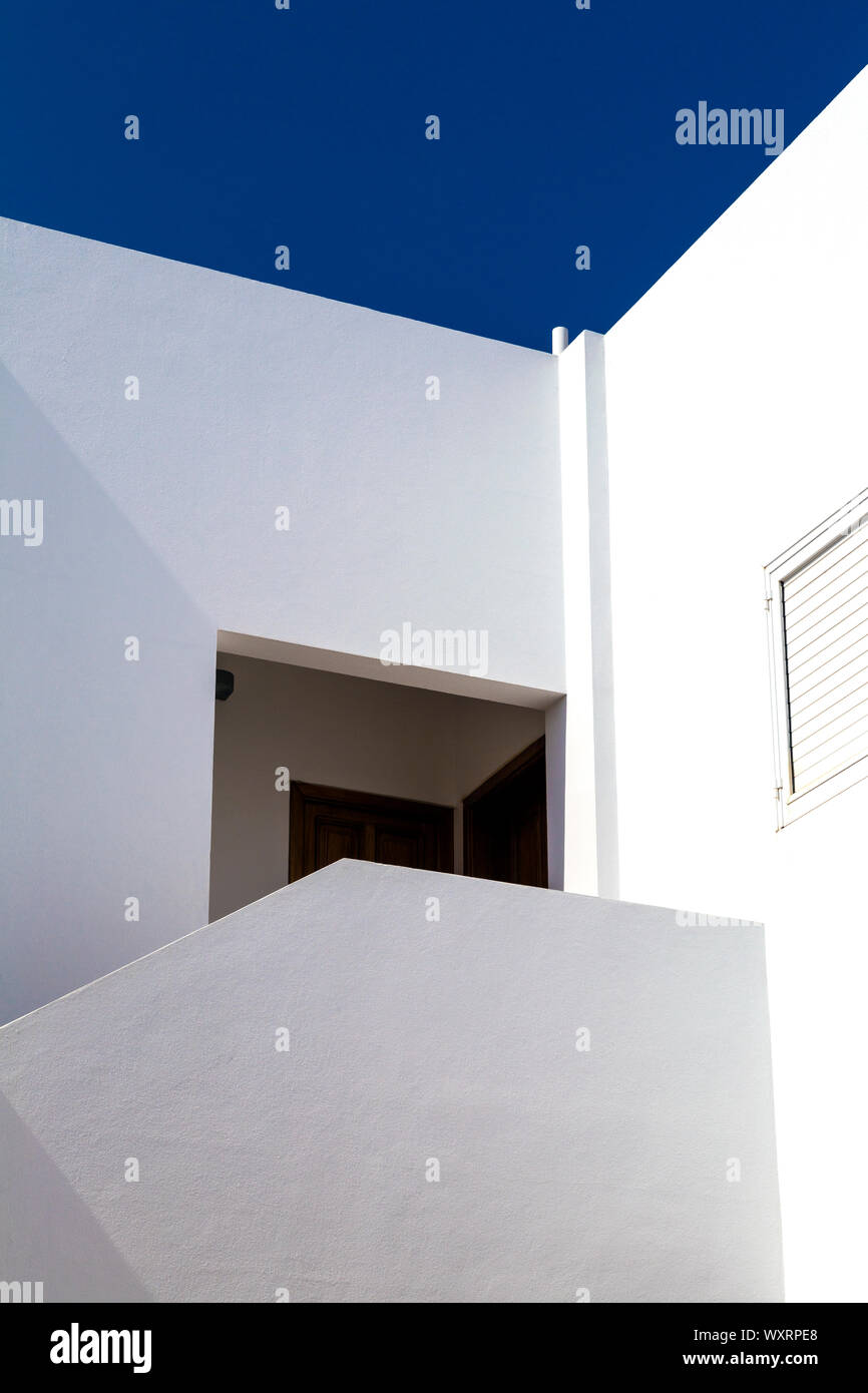 Detail of Mediterranean style architecture, whitewash walls agains blue sky in Sant Francesc Xavier, Formentera, Balearic Islands, Spain Stock Photo